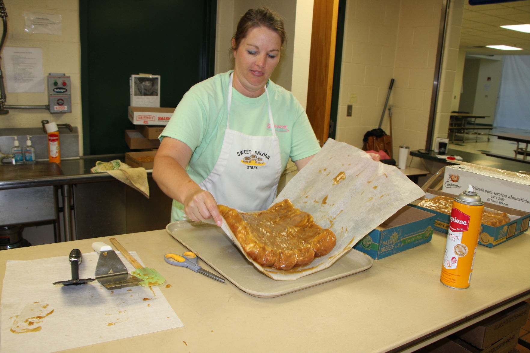 Lori Mau carefully packages the rolls